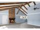 Spacious living room with brick fireplace, vaulted ceilings, wooden beams, and ample natural light at 407 Hayne St, Walterboro, SC 29488
