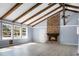 Bright and airy living room featuring a brick fireplace and vaulted ceilings at 407 Hayne St, Walterboro, SC 29488