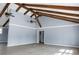 Bright, spacious living room with vaulted ceilings, exposed beams, and multiple ceiling fans at 407 Hayne St, Walterboro, SC 29488
