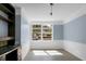 Well-lit office space with a large window, built-in desk, and neutral wall colors at 407 Hayne St, Walterboro, SC 29488