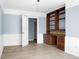 Study with ample natural light, built-in shelves and desk, and a comfortable workspace at 407 Hayne St, Walterboro, SC 29488