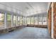 Sun room with brick accent wall and lots of windows at 407 Hayne St, Walterboro, SC 29488