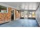 Sun room with brick accent wall and lots of windows at 407 Hayne St, Walterboro, SC 29488