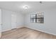 Bedroom featuring hardwood floors, a closet, and a bright window at 4928 Gaynor Ave, North Charleston, SC 29405