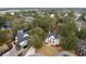 Aerial view of a beautiful neighborhood showcasing lush greenery, surrounding trees, and the nearby coastline at 499 Lackland Ct, Mount Pleasant, SC 29464
