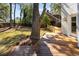 Spacious backyard with a wooden deck, mature trees, and a view of the neighboring property, ideal for outdoor living at 499 Lackland Ct, Mount Pleasant, SC 29464