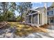 Beautiful backyard featuring a screened-in porch, lush green lawn, and mature trees, perfect for outdoor relaxation at 499 Lackland Ct, Mount Pleasant, SC 29464