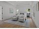 Inviting bedroom with a tray ceiling, two armchairs, two windows and soft natural light creating a peaceful retreat at 499 Lackland Ct, Mount Pleasant, SC 29464