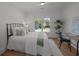 Inviting bedroom with large window, ceiling fan and stylish decor at 499 Lackland Ct, Mount Pleasant, SC 29464