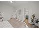 Spacious bedroom with white walls and trim, featuring access to the bathroom at 499 Lackland Ct, Mount Pleasant, SC 29464