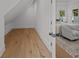 Hallway leading to a bedroom with views of the outdoor scenery creating a sense of openness and connection at 499 Lackland Ct, Mount Pleasant, SC 29464