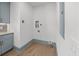 Laundry room with blue cabinets and modern appliances, offering a practical and stylish utility space at 499 Lackland Ct, Mount Pleasant, SC 29464