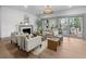 Bright living room featuring neutral furniture, fireplace, hardwood floors, and sliding doors to the outdoor space at 499 Lackland Ct, Mount Pleasant, SC 29464