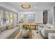 Open-concept living room with views to the dining and kitchen areas and sliding door access to the backyard at 499 Lackland Ct, Mount Pleasant, SC 29464