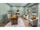 Stylish office with calming green walls, bright windows, hardwood floors, and contemporary furniture at 499 Lackland Ct, Mount Pleasant, SC 29464