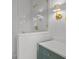Close-up of the shower featuring white subway tile and brass hardware and fixtures at 499 Lackland Ct, Mount Pleasant, SC 29464