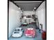 Luxury garage with a loft featuring a pool table and two classic cars at 567 Faison Rd # 7, Mount Pleasant, SC 29466