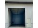 Empty storage unit featuring overhead lighting and a standard sized side door at 567 Faison Rd # 7, Mount Pleasant, SC 29466