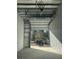 Spacious interior unit featuring concrete floor, metal walls and ceiling, and roll up door at 567 Faison Rd # 7, Mount Pleasant, SC 29466