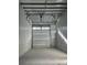 Interior view of a storage unit featuring a concrete floor and closed overhead door at 567 Faison Rd # 8, Mount Pleasant, SC 29466
