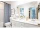 Bright bathroom with a modern vanity, patterned shower curtain, and decorative accents at 593 Red Monarch Way, Moncks Corner, SC 29461