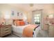 Stylish bedroom with vibrant artwork, a comfortable bed, and a cheerful atmosphere at 593 Red Monarch Way, Moncks Corner, SC 29461