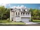 Charming two-story home with a welcoming front porch and a well-maintained yard at 593 Red Monarch Way, Moncks Corner, SC 29461