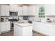 Modern kitchen featuring white cabinets, stainless steel appliances, and a center island at 593 Red Monarch Way, Moncks Corner, SC 29461