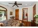 Bedroom with wood floors and ensuite bathroom in view at 5991 Joseph Blake Ln, Wadmalaw Island, SC 29487