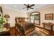 Bedroom with wood floors, area rug and window overlooking the outdoors at 5991 Joseph Blake Ln, Wadmalaw Island, SC 29487