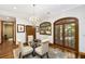 Charming breakfast nook features a chandelier and a glass-top table at 5991 Joseph Blake Ln, Wadmalaw Island, SC 29487