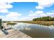 Picturesque view from the community dock with clear water and surrounding nature at 5991 Joseph Blake Ln, Wadmalaw Island, SC 29487