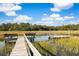 Community dock offering seating and easy access to beautiful waterfront at 5991 Joseph Blake Ln, Wadmalaw Island, SC 29487