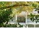 Beautiful home entrance with a grand porch, complemented by lush greenery at 5991 Joseph Blake Ln, Wadmalaw Island, SC 29487