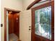Unique entryway featuring a home elevator, stained glass door, and detailed trim work at 5991 Joseph Blake Ln, Wadmalaw Island, SC 29487