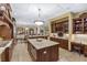 Spacious kitchen with custom cabinetry, granite counters and center island, and modern stainless steel appliances at 5991 Joseph Blake Ln, Wadmalaw Island, SC 29487