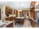 Gourmet kitchen featuring granite countertops, custom wood cabinetry, and stainless steel appliances at 5991 Joseph Blake Ln, Wadmalaw Island, SC 29487