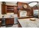 Spacious kitchen with granite counters, custom cabinetry and stainless steel appliances at 5991 Joseph Blake Ln, Wadmalaw Island, SC 29487