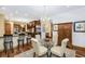 Eat-in kitchen with breakfast bar, dining area, and stainless steel appliances at 5991 Joseph Blake Ln, Wadmalaw Island, SC 29487