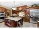 Chef's kitchen with granite countertops, stainless steel appliances, and custom wood cabinetry at 5991 Joseph Blake Ln, Wadmalaw Island, SC 29487