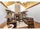 Charming living room featuring a stone fireplace, vaulted ceilings, and hardwood floors at 5991 Joseph Blake Ln, Wadmalaw Island, SC 29487