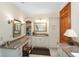 This spacious bathroom features granite countertops, a vanity, and cabinet storage at 5991 Joseph Blake Ln, Wadmalaw Island, SC 29487