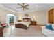 This main bedroom features neutral colors, natural light, and matching nightstands at 5991 Joseph Blake Ln, Wadmalaw Island, SC 29487