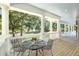 Outdoor porch with seating area and view of the grounds at 5991 Joseph Blake Ln, Wadmalaw Island, SC 29487