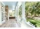 Covered porch with stone pillar and view of the outdoors at 5991 Joseph Blake Ln, Wadmalaw Island, SC 29487
