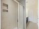 Bathroom with a tiled shower including a glass door and built in shower caddy at 612 Mclernon Trce, Johns Island, SC 29455