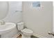 Half bathroom features a pedestal sink, standard toilet and tiled floors at 612 Mclernon Trce, Johns Island, SC 29455