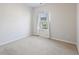 Bedroom with neutral walls, carpet, and a window with white curtains at 612 Mclernon Trce, Johns Island, SC 29455