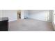 Empty bedroom with plush carpet, a large window, and an open closet at 612 Mclernon Trce, Johns Island, SC 29455