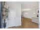 Inviting entryway featuring a stylish door wreath and a glimpse into the open-concept living space at 612 Mclernon Trce, Johns Island, SC 29455